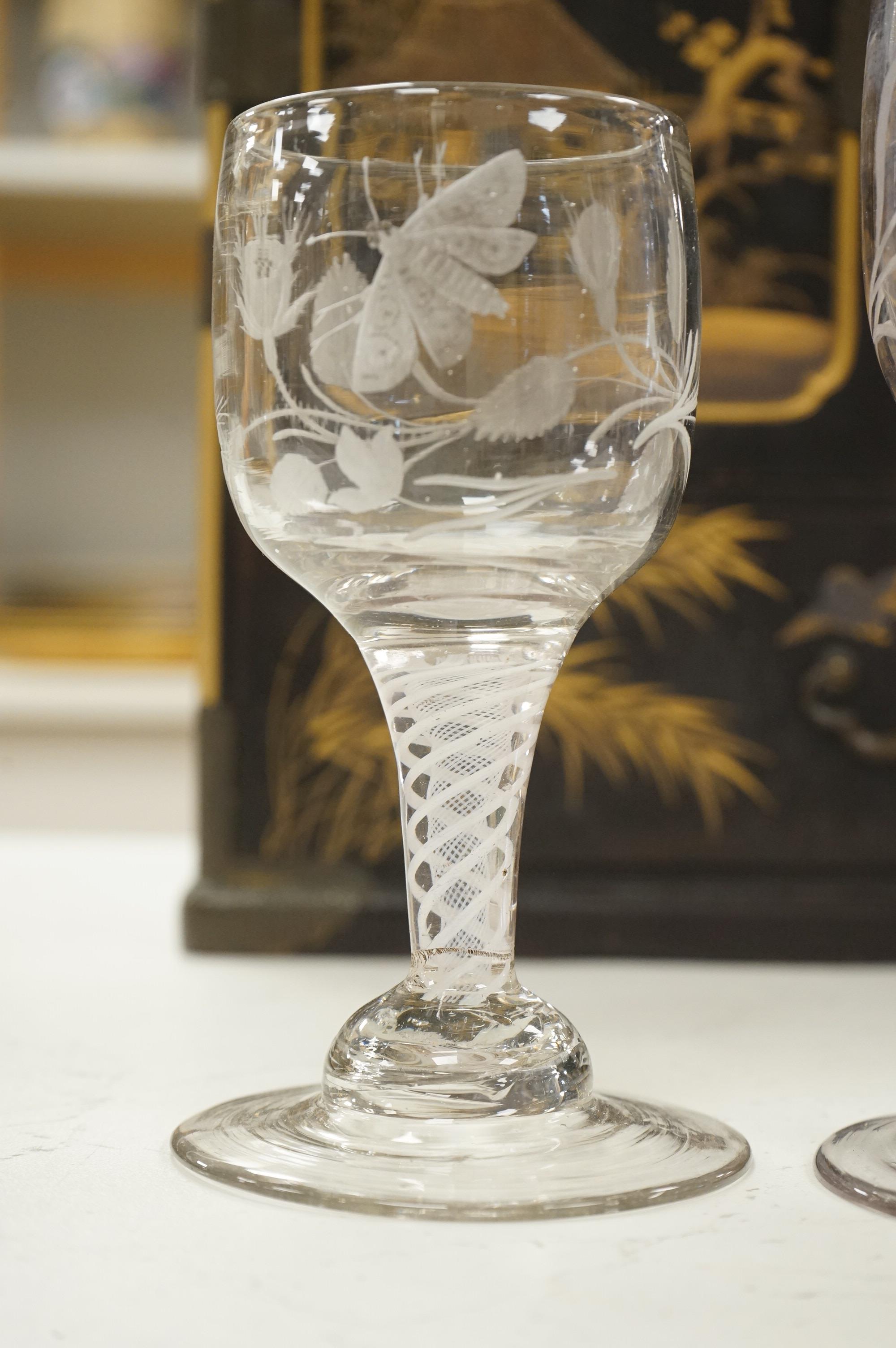 Three late 18th century Dutch DSOT stem goblets, each on a domed foot, engraved with a moth and flowers, 19.5cm and 18cm high